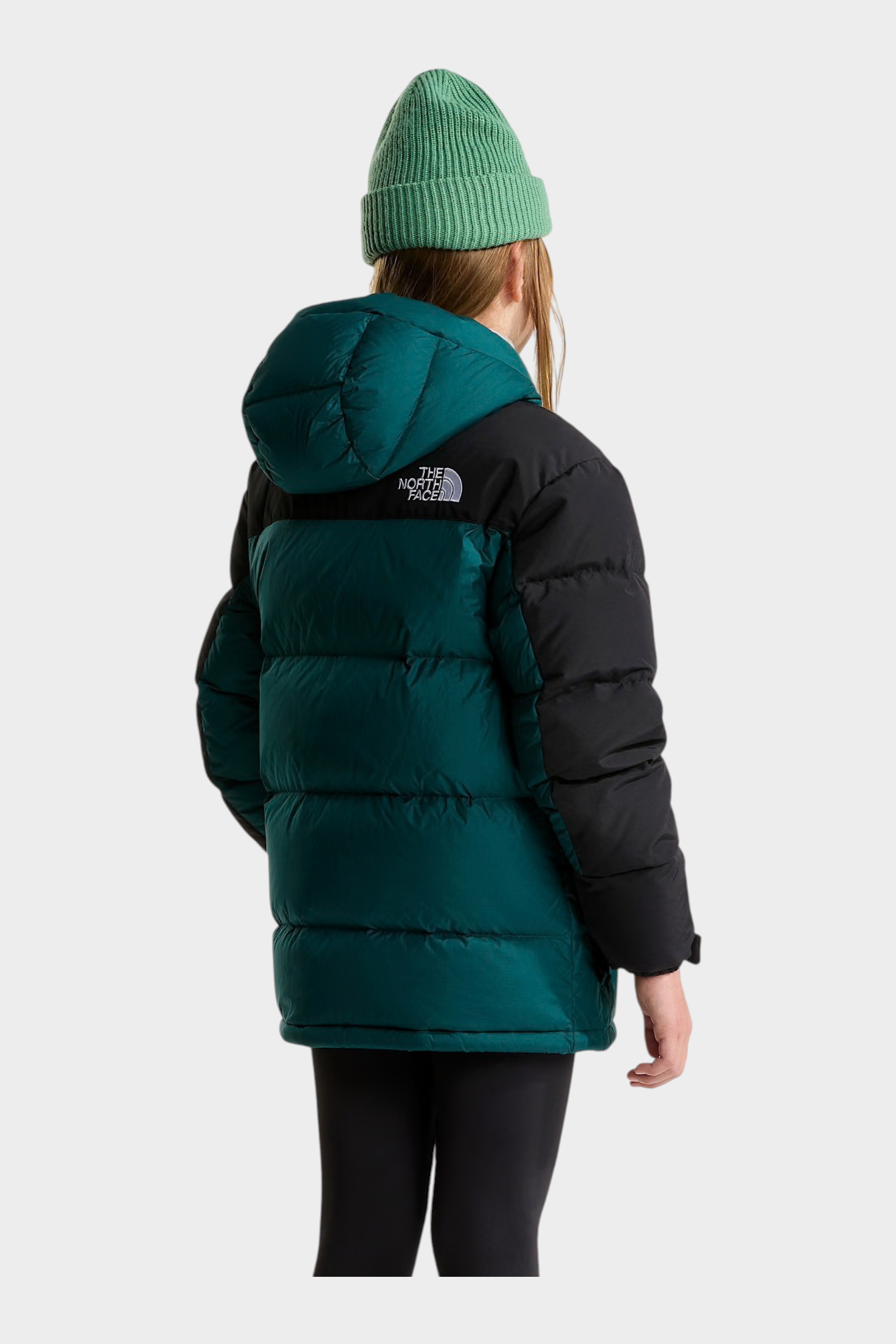 Parka corto Follower SRL The North Face verde e nero con imbottitura in piumino e cappuccio, indossato da una modella
