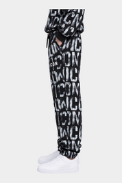 Pantaloni jogger Follower Official neri per bambino con stampa logo ICON all-over, vita elasticizzata e bordi a costine