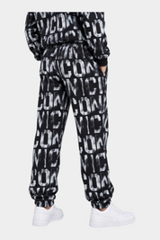 Pantaloni jogger Follower Official neri per bambino con stampa logo ICON all-over, vita elasticizzata e polsini a costine