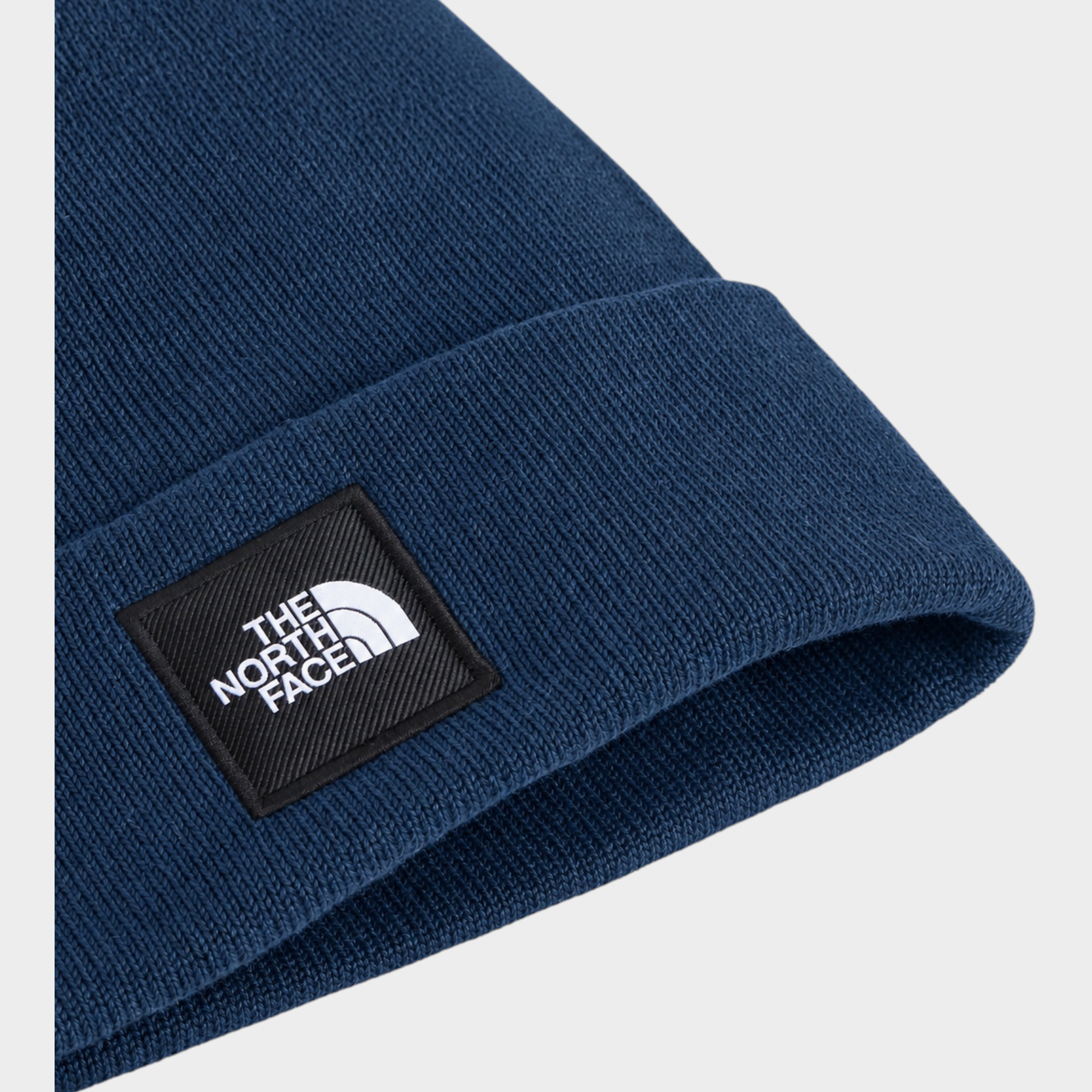 Berretto Dock Worker Follower SRL blu in maglia a coste con logo The North Face applicato sul risvolto