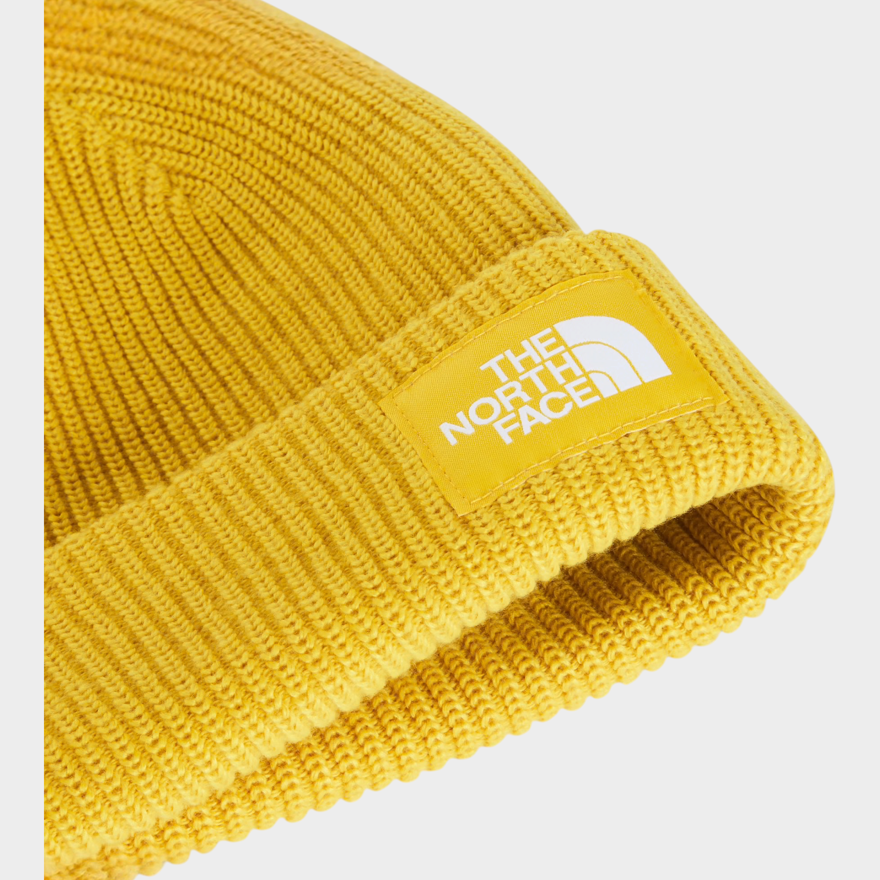 Berretto unisex giallo a coste The North Face con etichetta logo in evidenza, venduto da Follower SRL