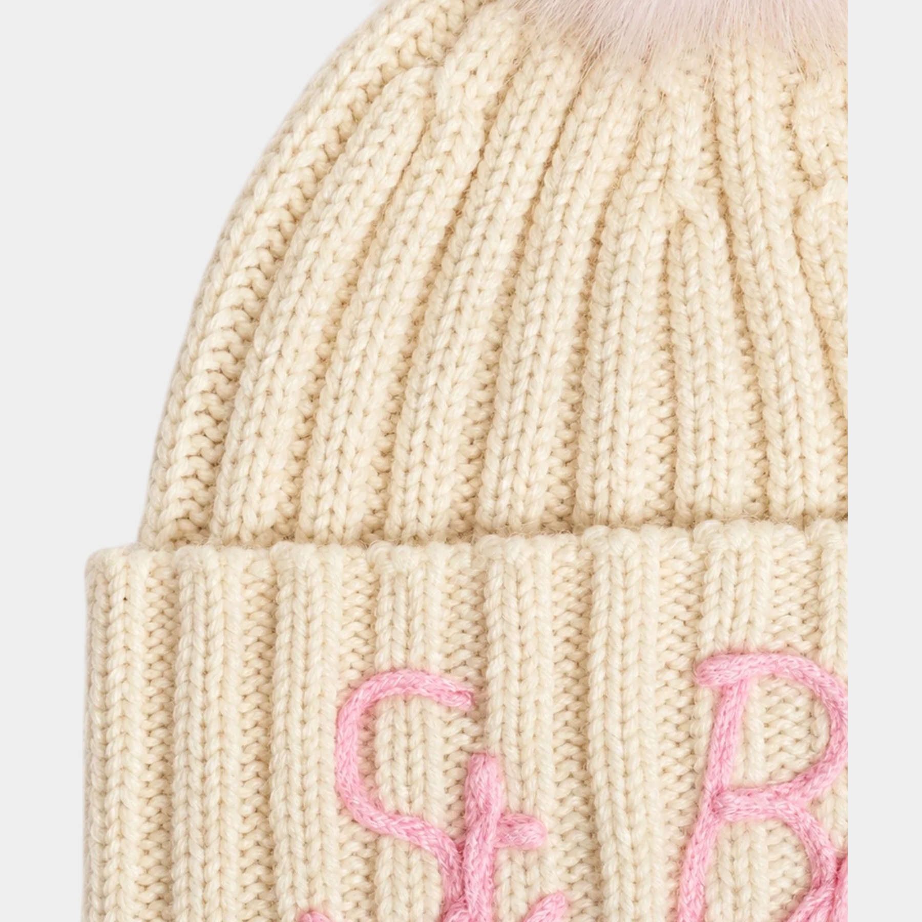 Berretto Follower SRL Wengen color avorio a costine con pompon e ricamo rosa per bambina