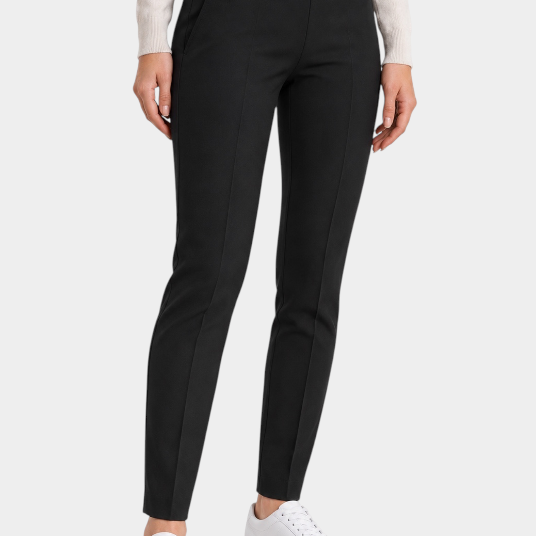 Follower SRL black cigarette trousers with belt loops and a small metallic detail on the waist, worn with white sneakers