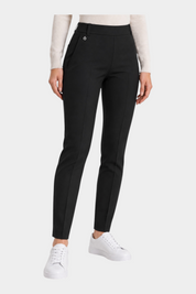 Follower SRL black cigarette trousers with belt loops and a small metallic detail on the waist, worn with white sneakers
