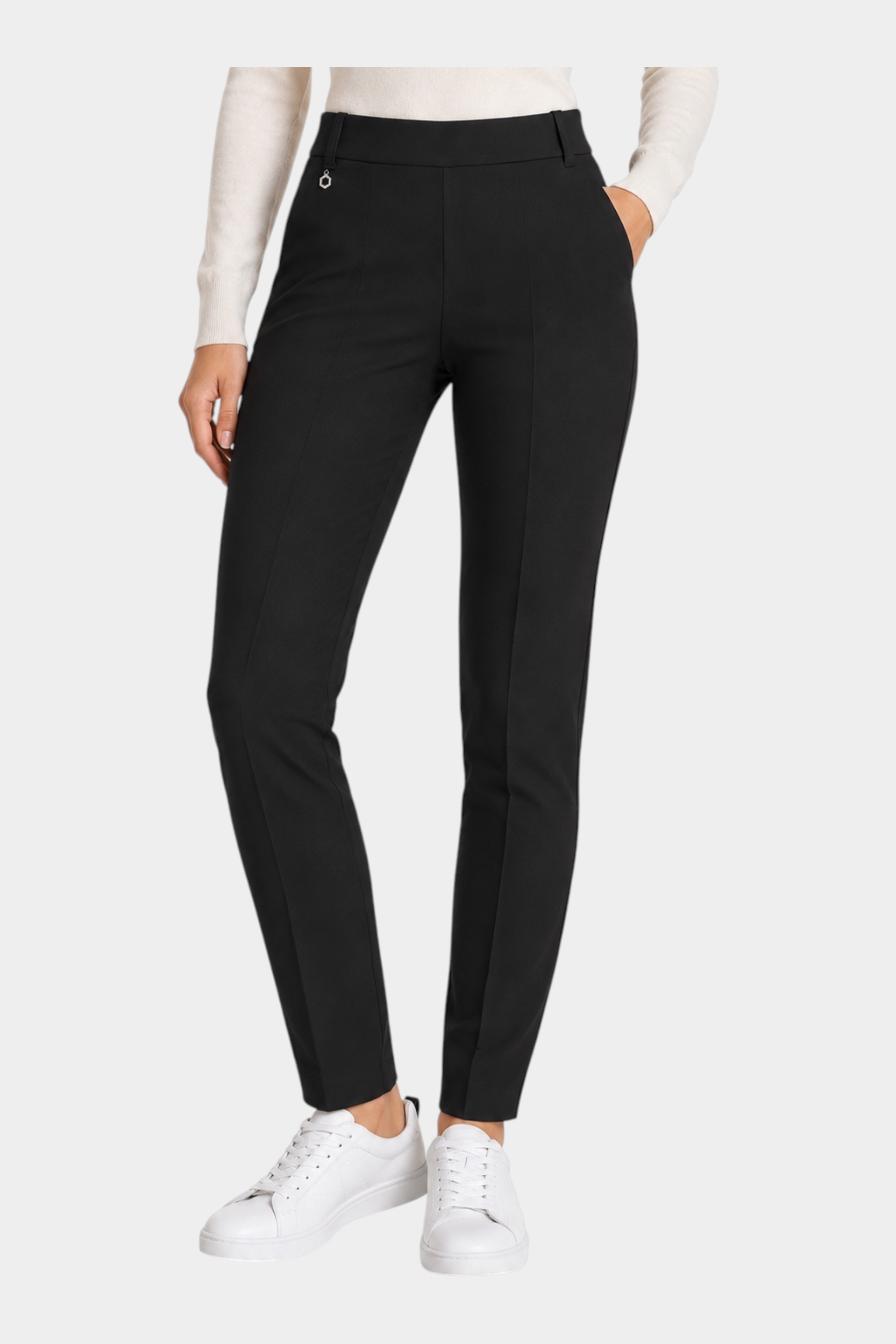 Follower SRL black cigarette trousers with belt loops and a small metal detail, worn with a white top and sneakers.