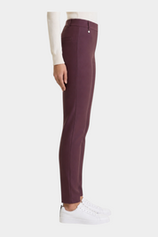 Follower SRL bordeaux cigarette trousers in compact fabric with belt loops, side view on model with white sneakers