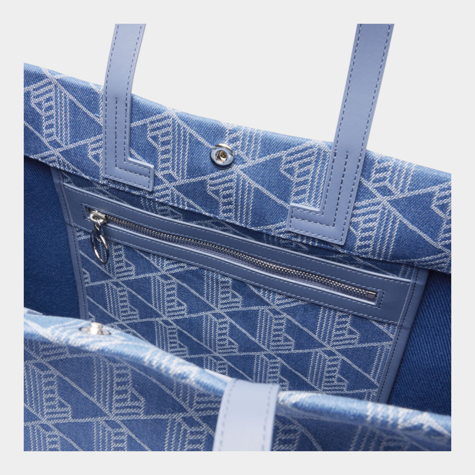 Interno della borsa grande Follower SRL in tessuto jacquard blu con stampa geometrica Heritage e tasca con zip