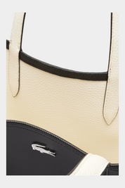 Dettaglio borsa reversibile Follower SRL Lacoste Anna in pelle martellata color crema e tessuto tecnico nero