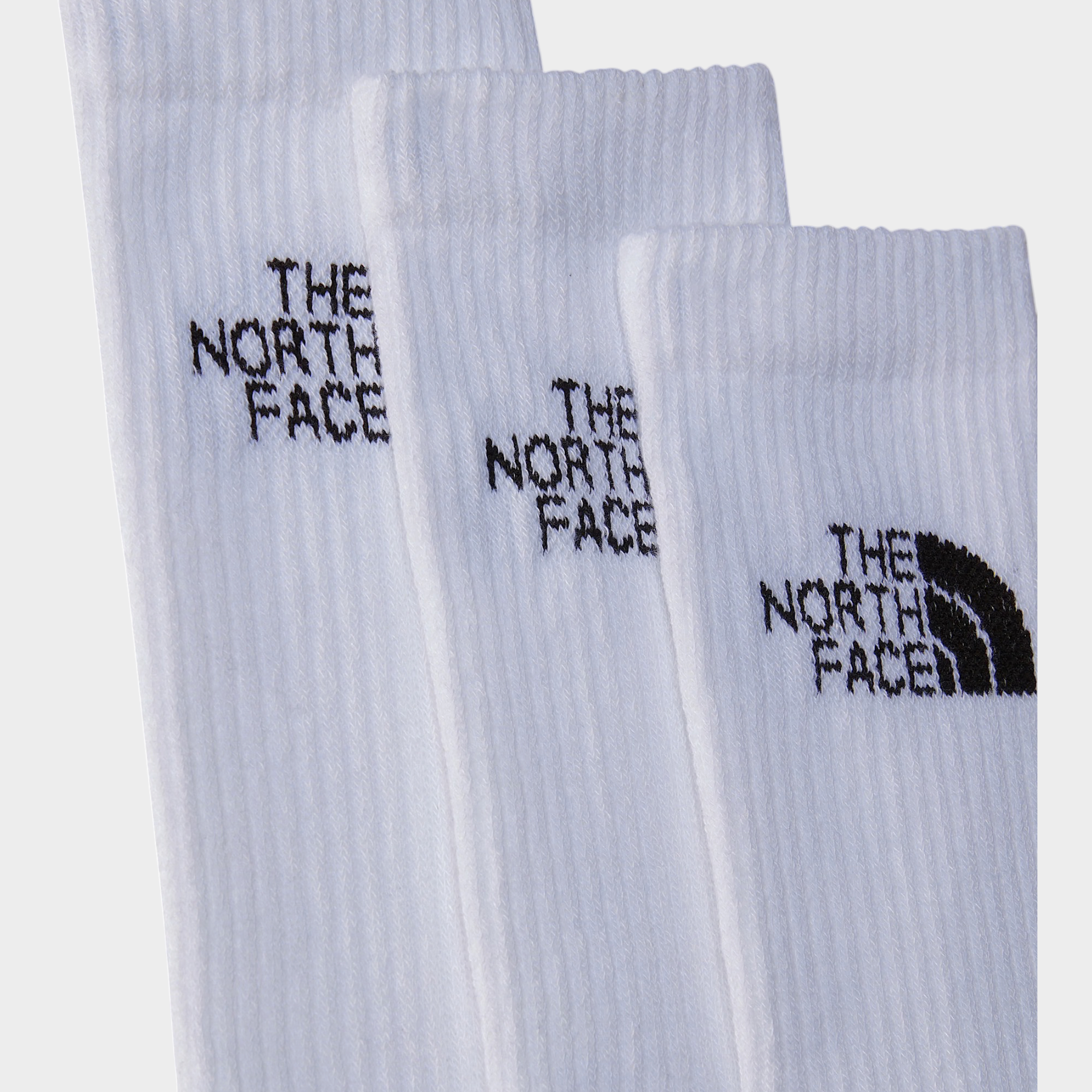 Calzini sportivi bianchi a coste Follower SRL con logo The North Face nero ricamato sul polsino