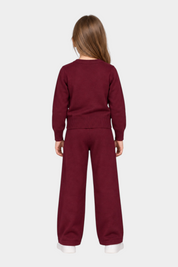 Bambina di spalle indossa completo Follower SRL bordeaux composto da maglia e pantaloni in maglia a gamba larga