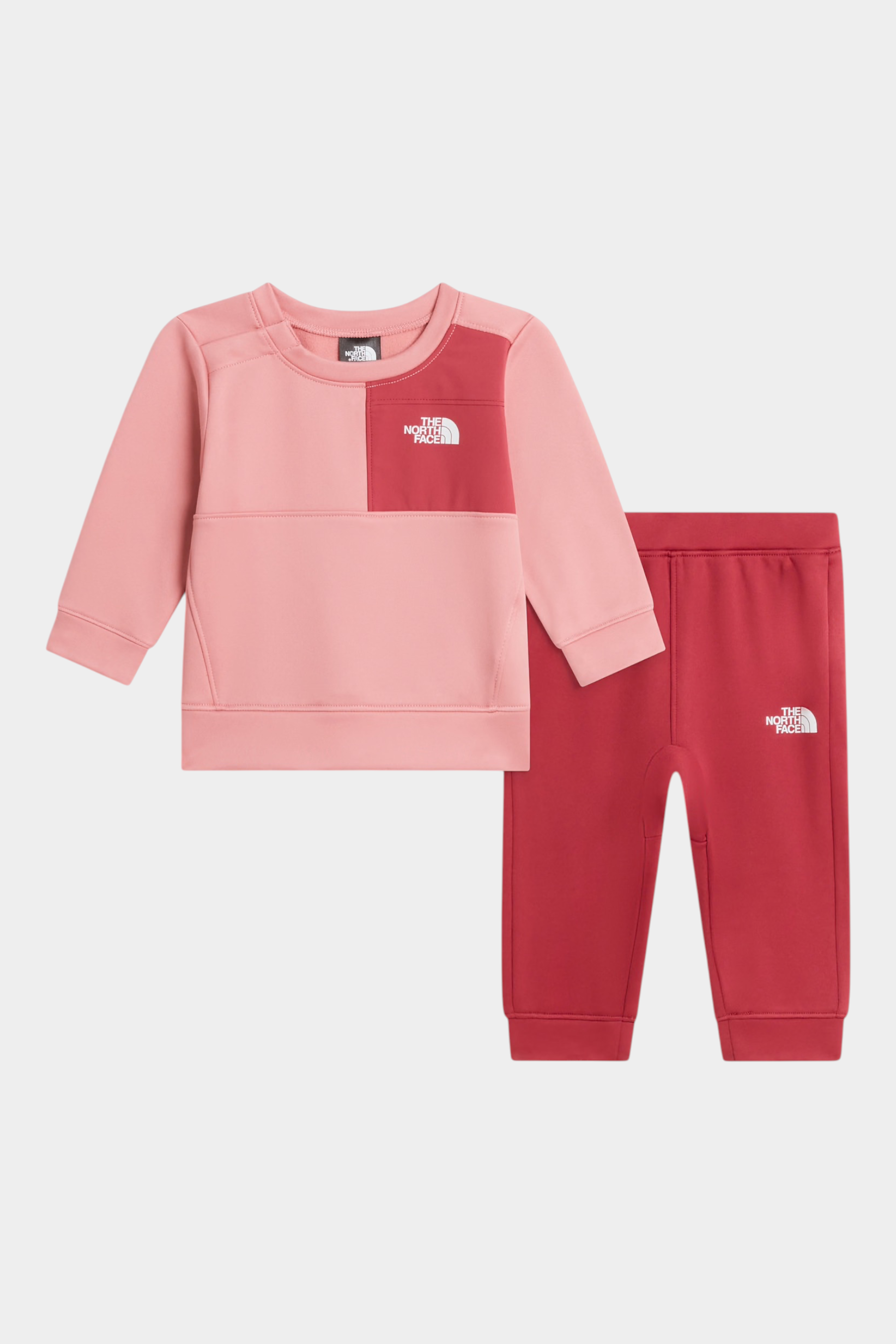 Completo due pezzi Follower SRL THE NORTH FACE per bambina, composto da felpa rosa e pantaloni rossi con logo