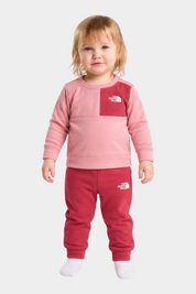Bambina indossa completo due pezzi Follower SRL THE NORTH FACE rosa e rosso con felpa e pantaloni sportivi