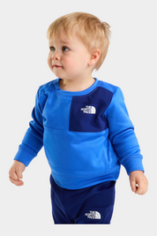 Bambino indossa completo due pezzi blu Follower SRL con logo The North Face su felpa e pantaloni