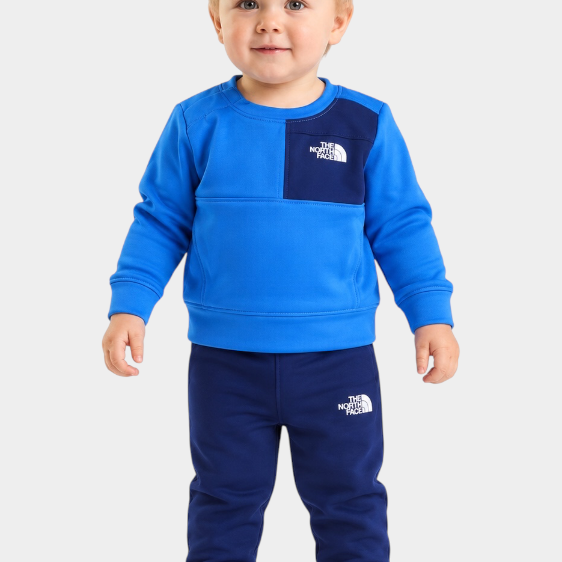 Bambino indossa completo due pezzi Follower SRL THE NORTH FACE blu con felpa e pantaloni sportivi