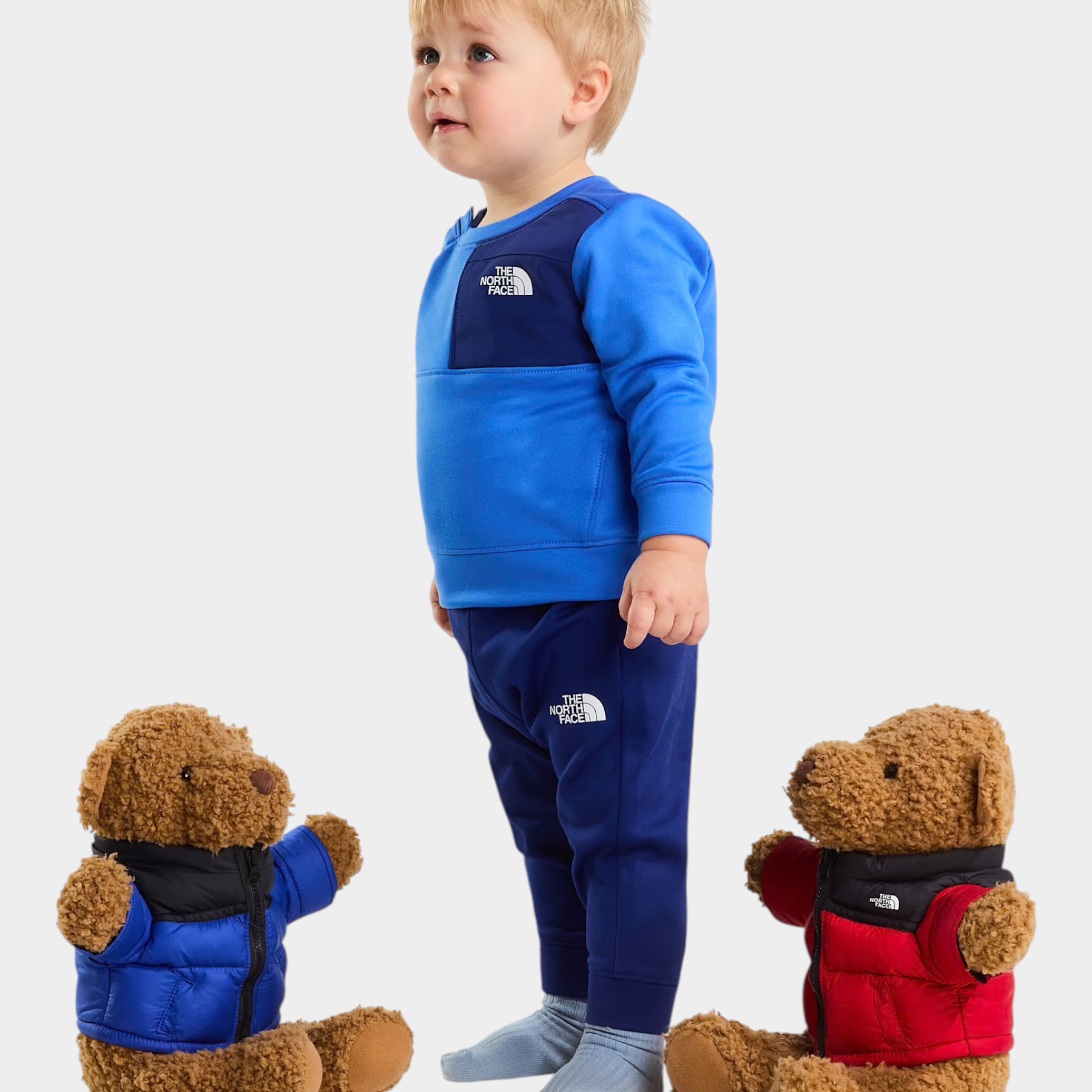 Bambino indossa completo due pezzi blu Follower SRL THE NORTH FACE con felpa e pantaloni sportivi