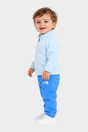 Bambino che indossa un completo in pile azzurro Follower SRL composto da felpa con zip e pantaloni coordinati
