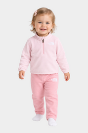 Bambina che indossa il completo due pezzi in pile rosa Glacier di Follower SRL con logo The North Face ricamato