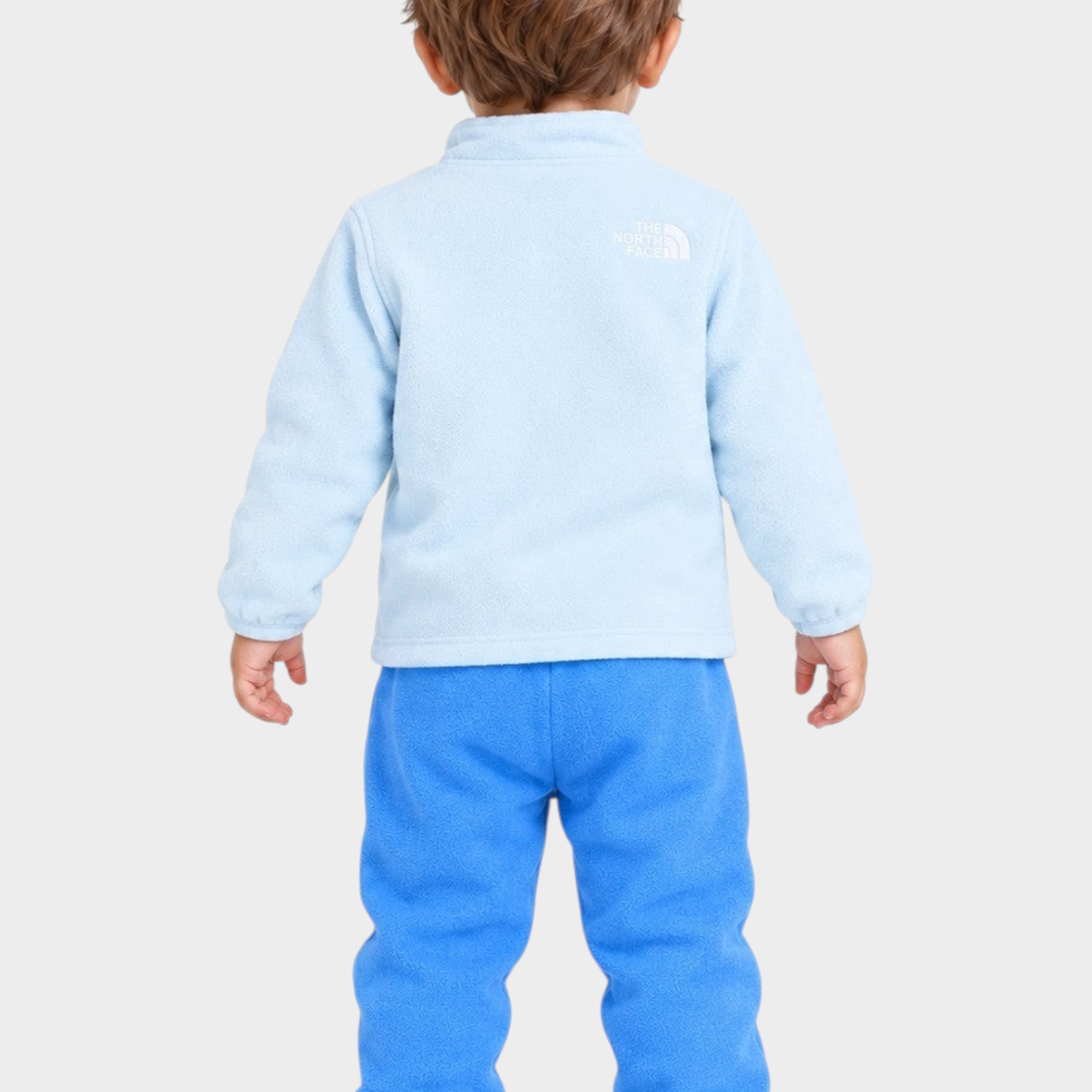 Completo due pezzi in pile Follower SRL per bambino, giacca azzurro chiaro e pantaloni blu con logo The North Face