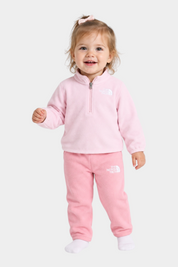 Bambina che indossa il completo due pezzi in pile rosa Follower SRL The North Face con zip corta e logo ricamato