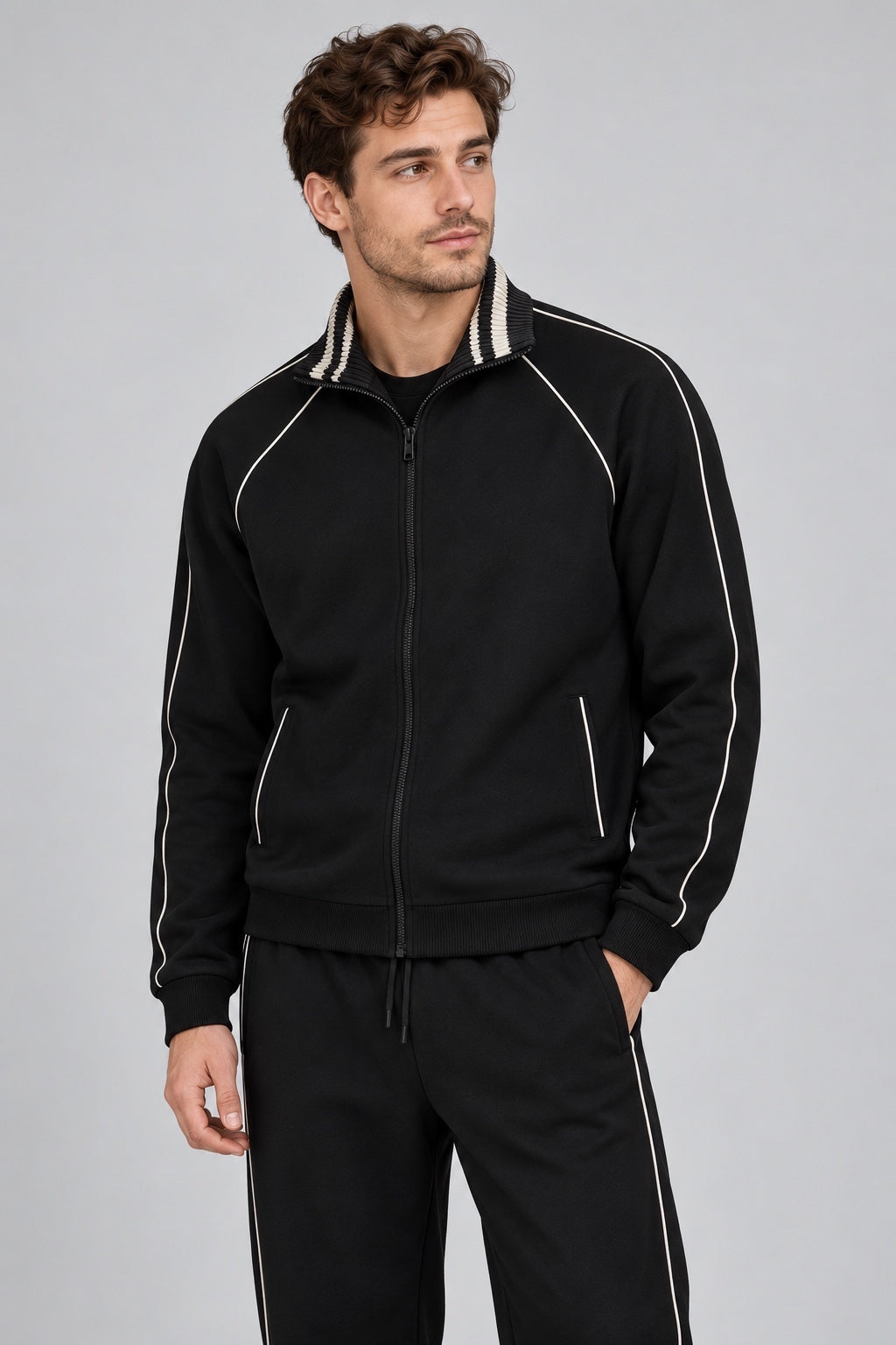 Felpa full zip nera GUESS con dettagli a righe sul colletto e profili bianchi, indossata da un modello Follower SRL