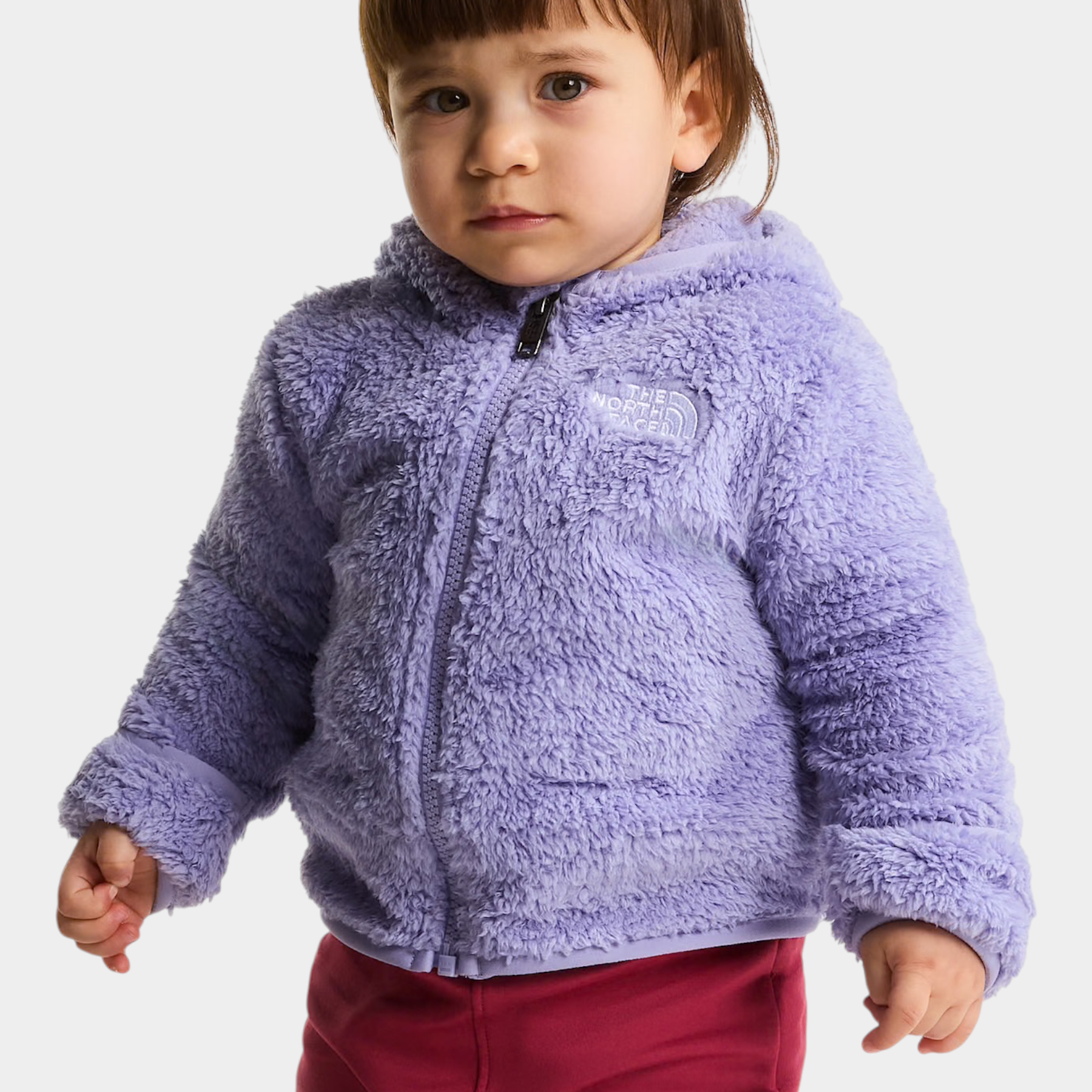 Bambina che indossa una felpa con cappuccio in pile viola The North Face Campshire di Follower SRL