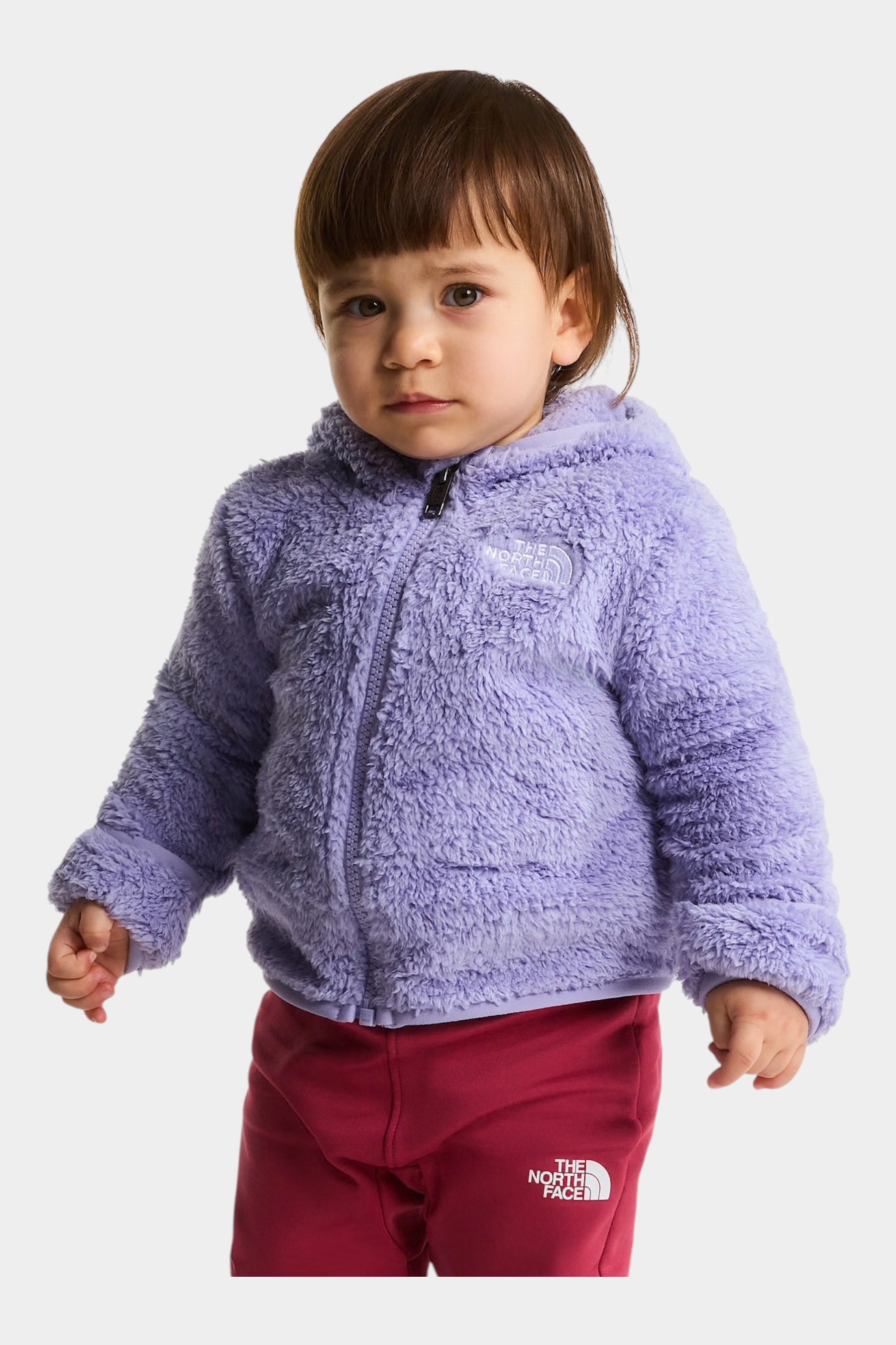 Bambina che indossa una felpa con cappuccio in pile viola The North Face Campshire di Follower SRL