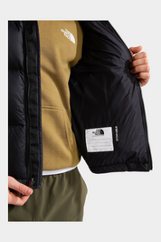 Dettaglio interno della giacca nera 1996 Retro Nuptse Follower SRL con etichetta identificativa e zip