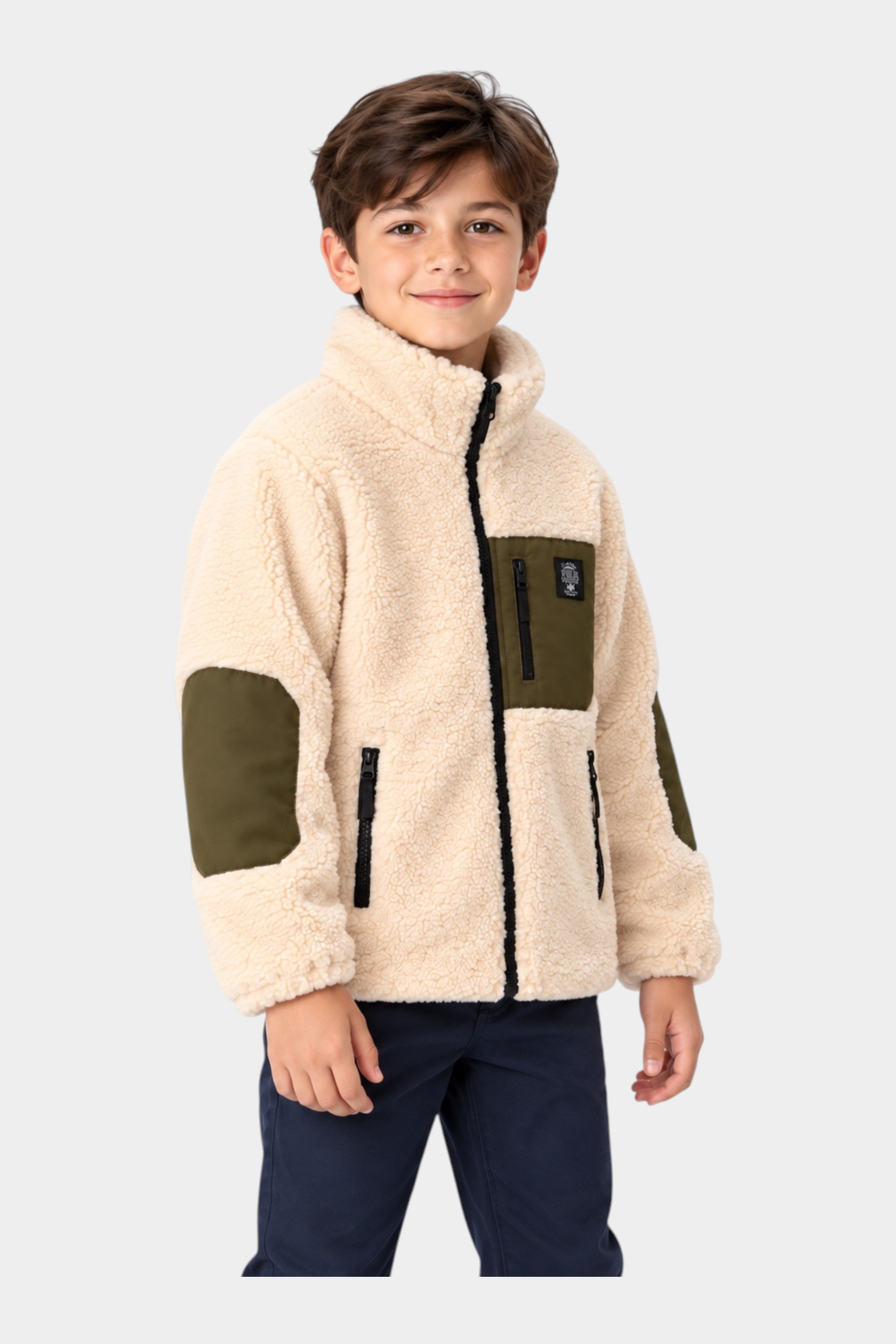 Bambino indossa giacca in pile Follower SRL color avorio con inserti verde oliva e chiusura a zip