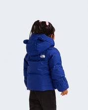 Bambina indossa giacca in piumino blu Follower SRL con cappuccio e logo The North Face, vista posteriore