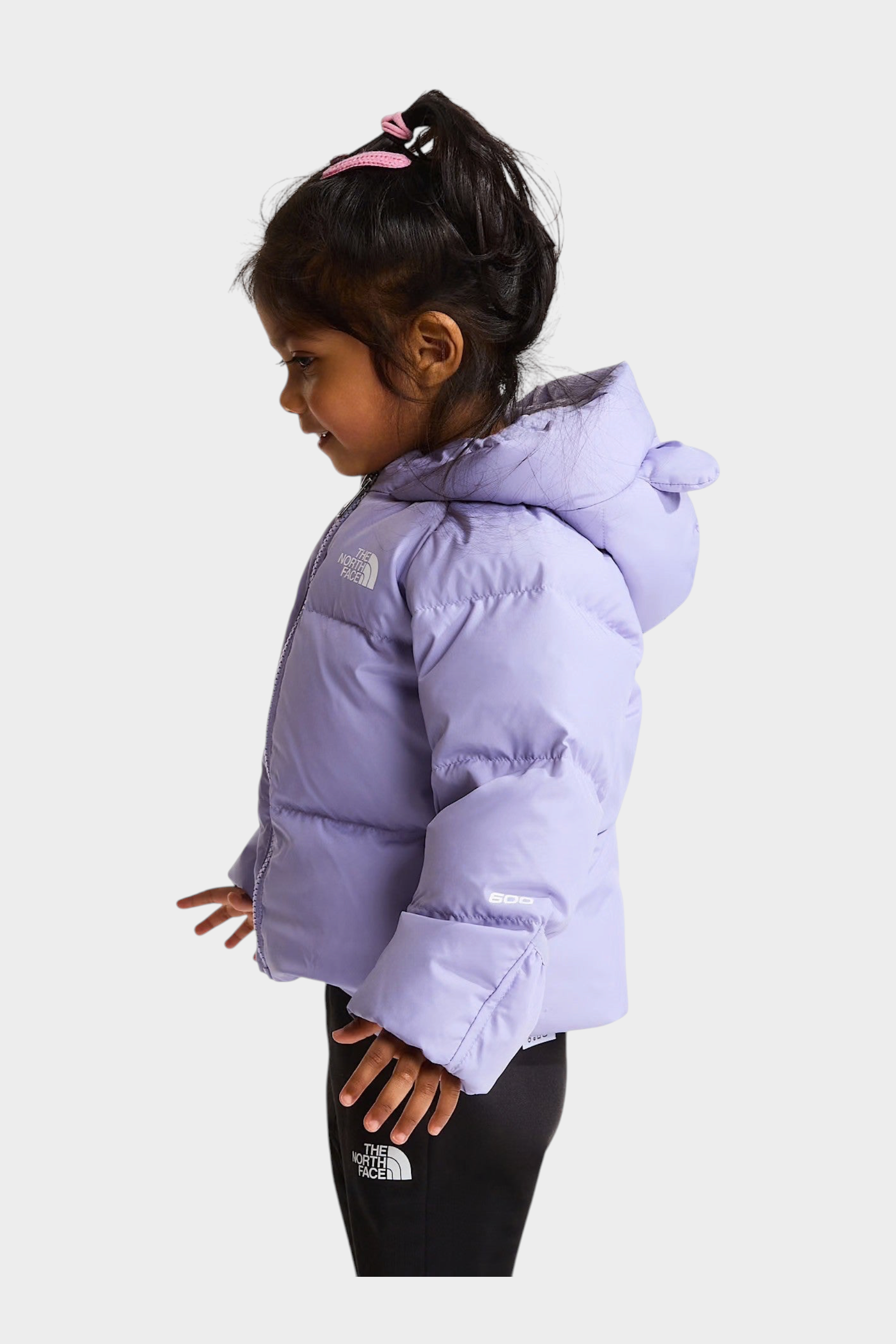 Bambina indossa giacca in piumino viola The North Face con fodera in pile, vista laterale, Follower SRL