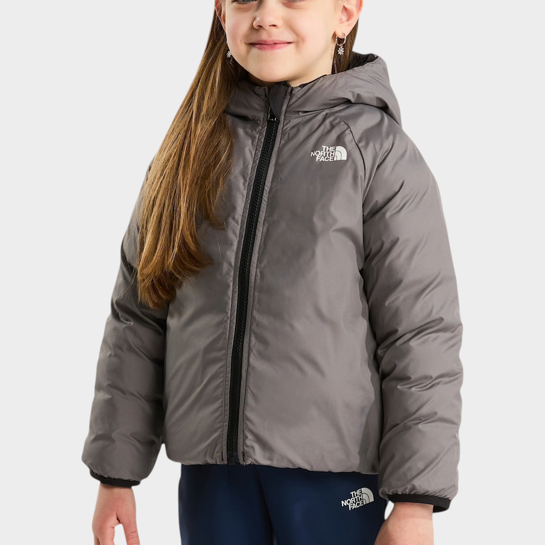 Bambina che indossa una giacca reversibile imbottita con cappuccio grigia Follower SRL The North Face