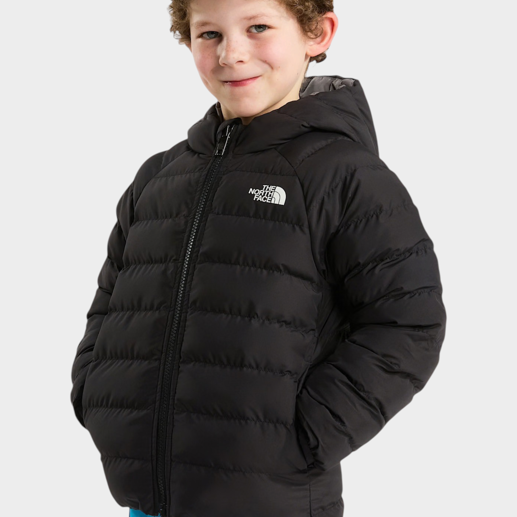 Bambino che indossa una giacca reversibile imbottita nera con cappuccio Follower SRL The North Face