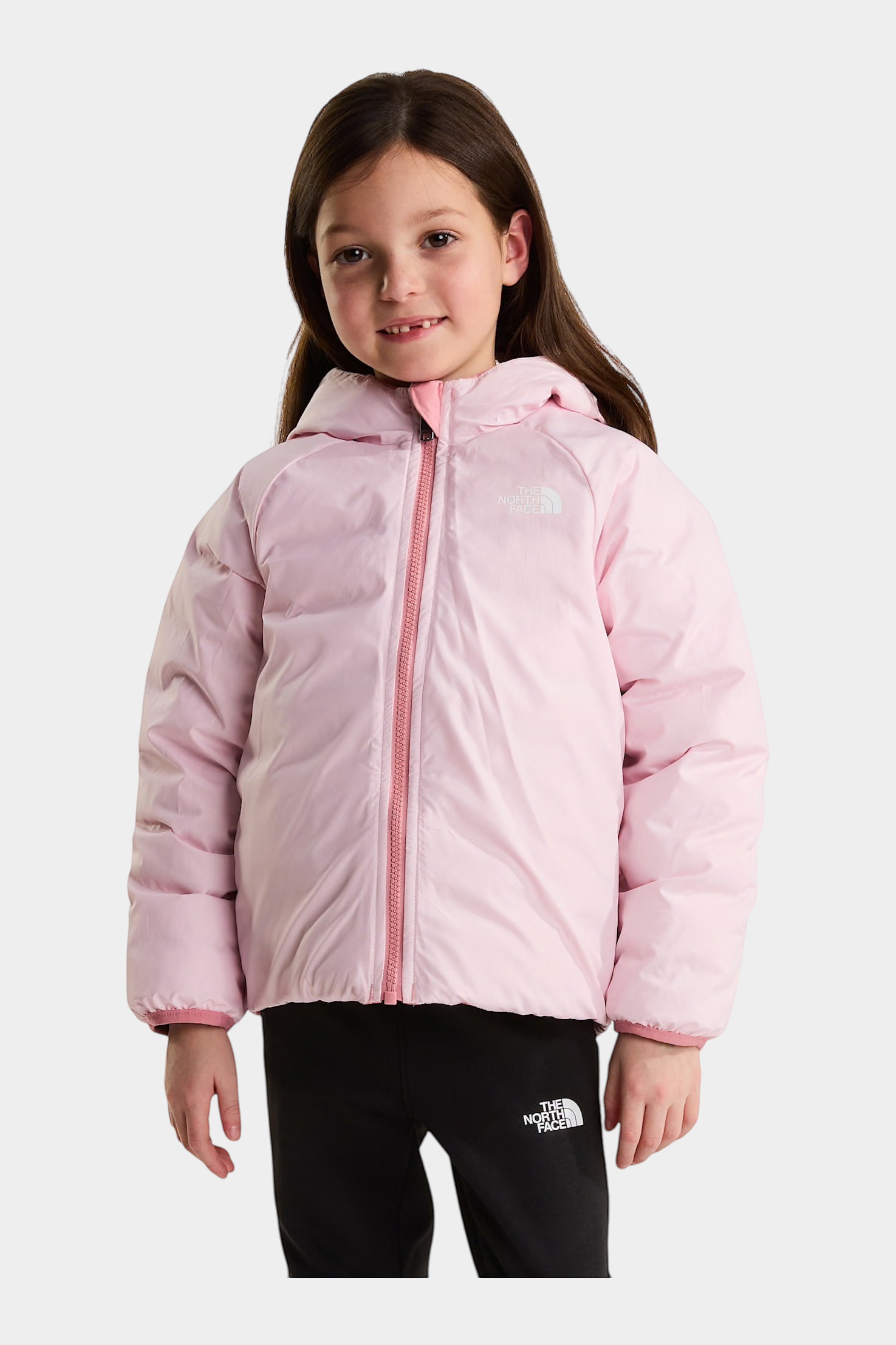 Bambina che indossa la giacca reversibile rosa Perrito di Follower SRL con cappuccio e chiusura a zip