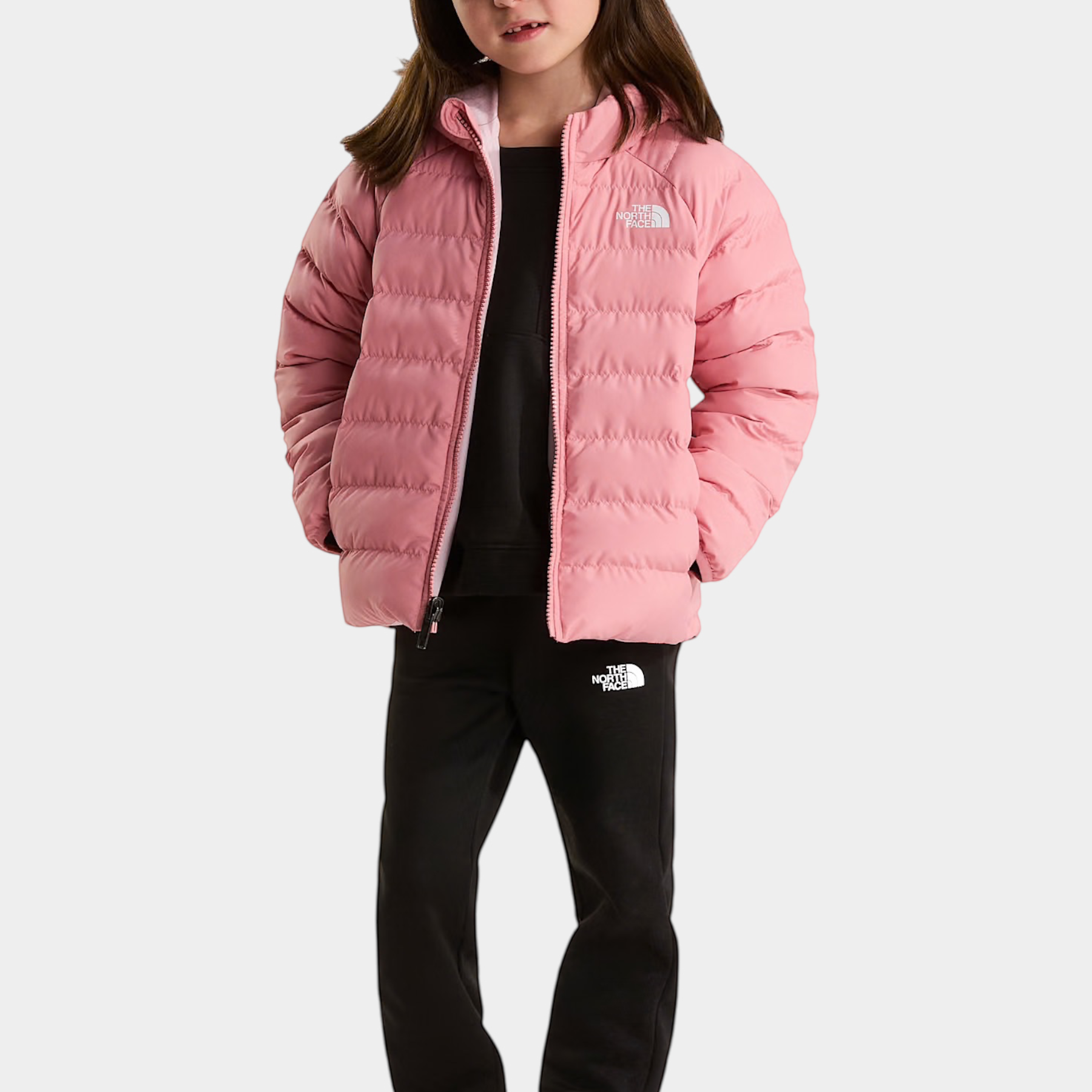 Bambina indossa giacca reversibile rosa The North Face modello Perrito, proposta da Follower SRL