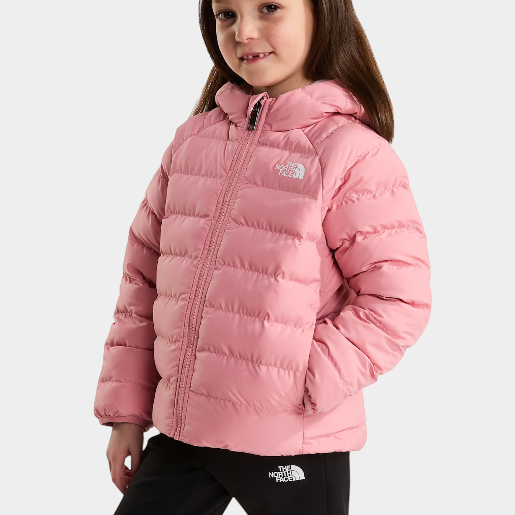 Bambina indossa giacca reversibile rosa Follower SRL The North Face con cappuccio e imbottitura trapuntata