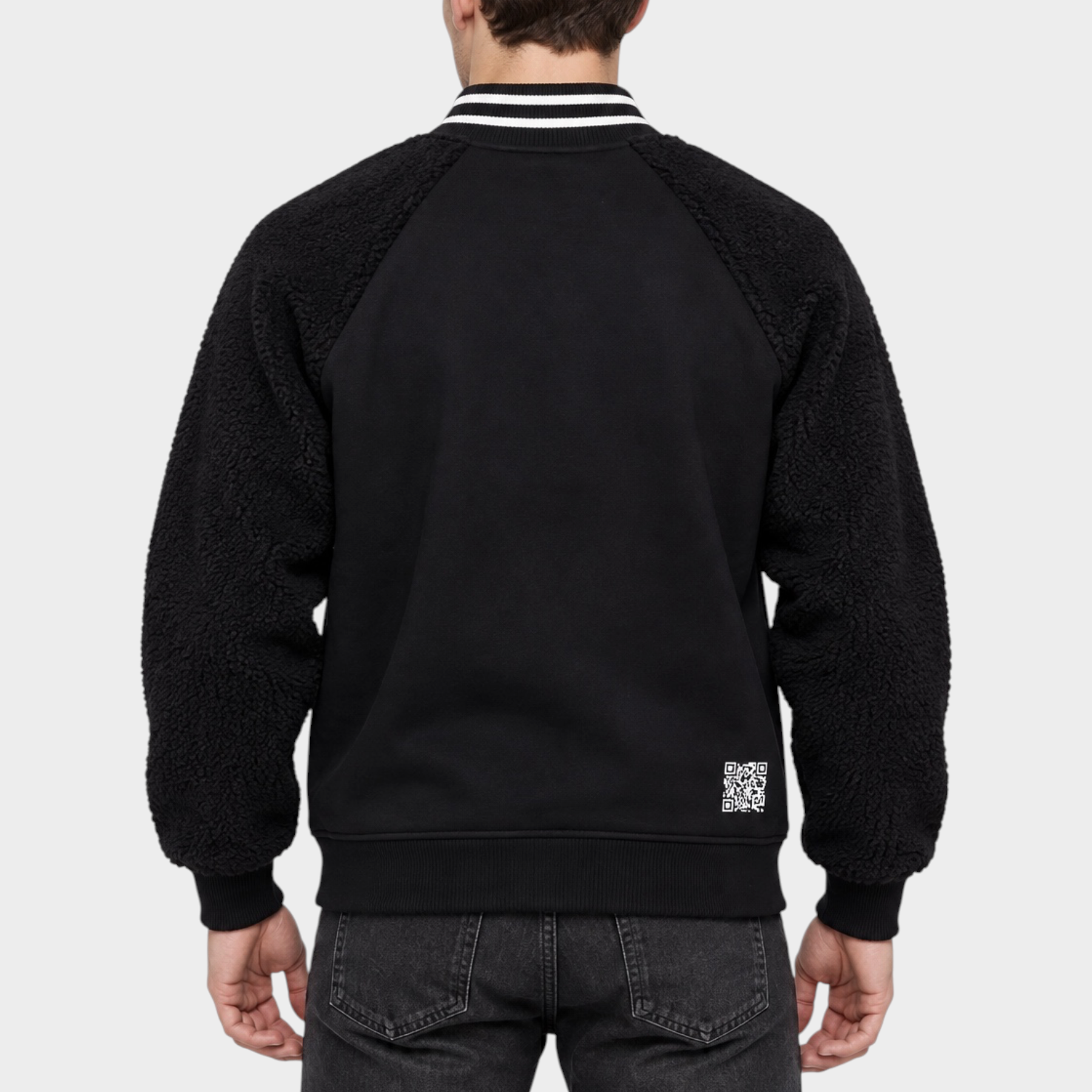 Vista posteriore del giubbino bomber nero Follower SRL con maniche in tessuto teddy e colletto a righe bianche