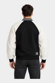 Vista posteriore del giubbino bomber Follower SRL nero con maniche in sherpa bianco e dettagli a righe sul colletto