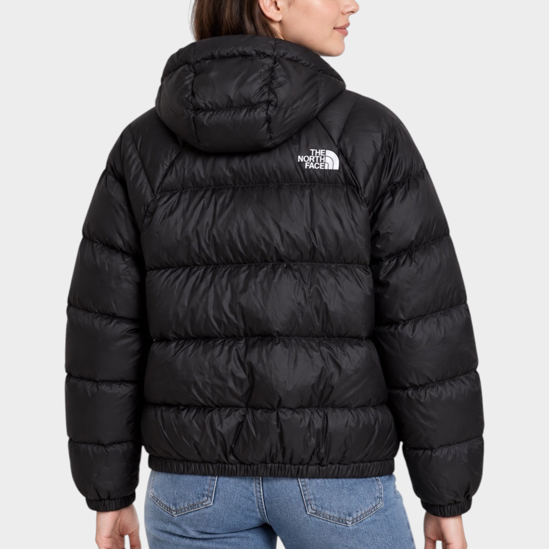 Donna indossa giubbino nero con cappuccio The North Face Hydrenalite, vista posteriore, venduto da Follower SRL