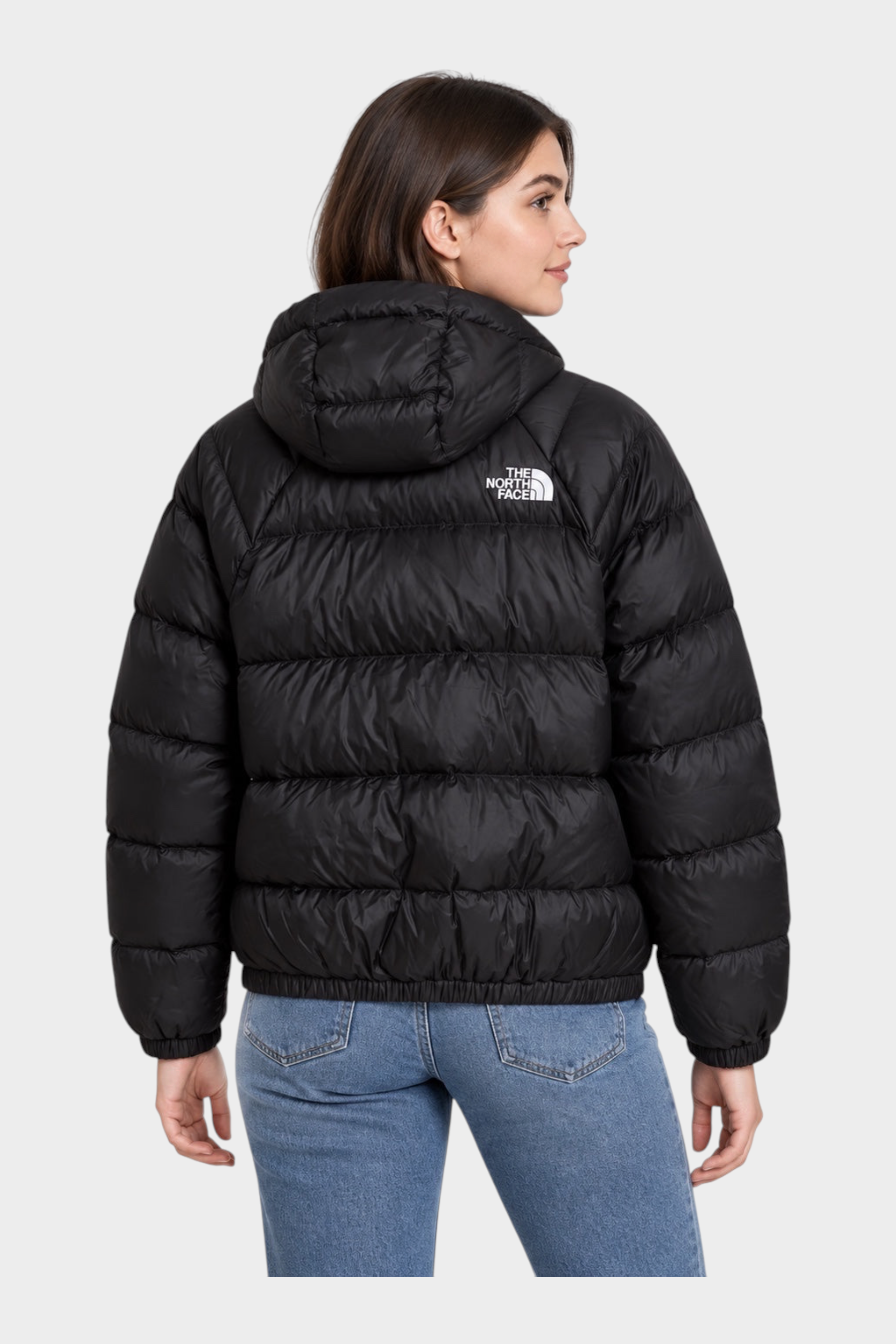 Donna indossa giubbino nero con cappuccio The North Face Hydrenalite, vista posteriore, venduto da Follower SRL
