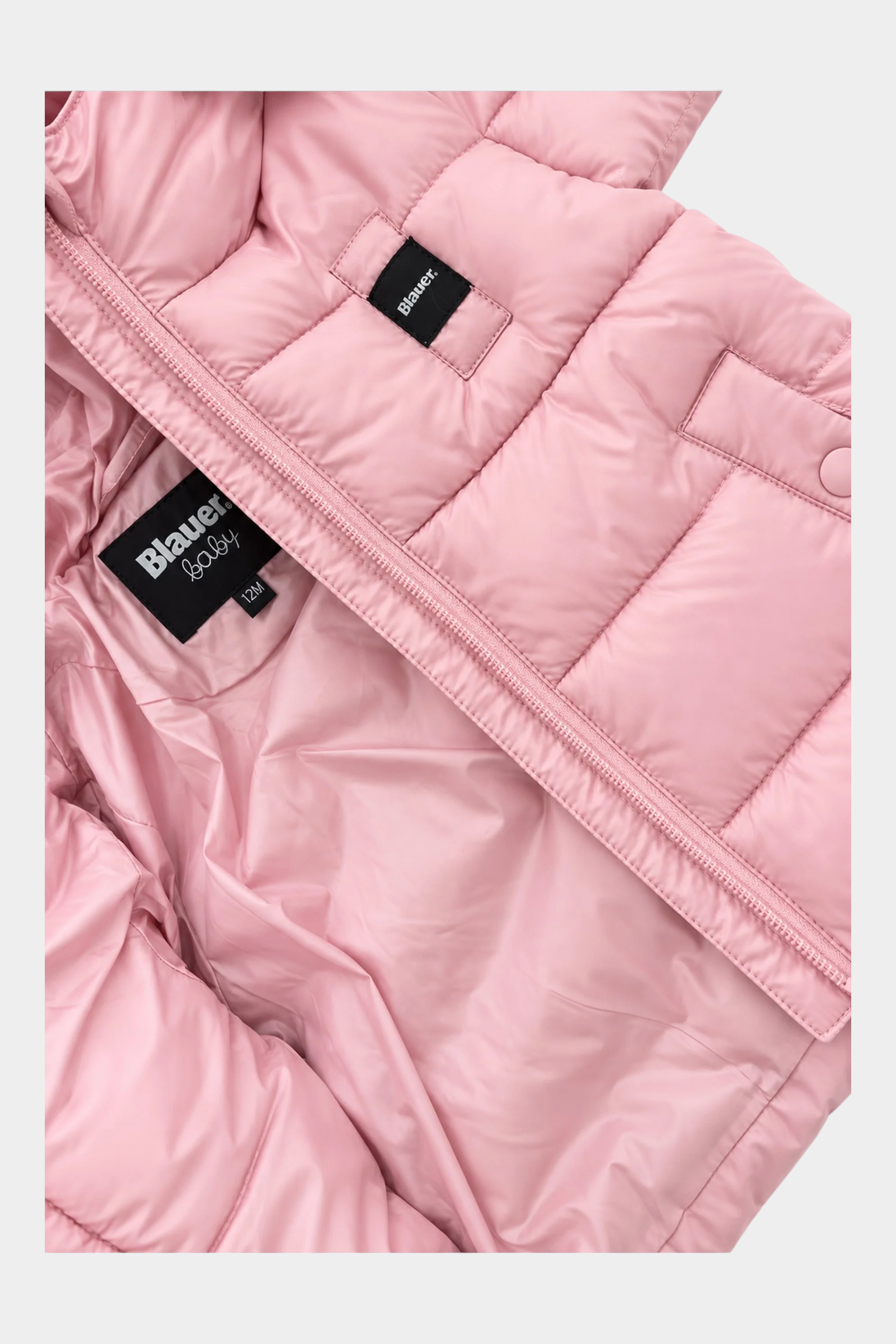 Dettaglio interno del giubbino unisex rosa Amory di Follower SRL con etichetta Blauer e chiusura a zip