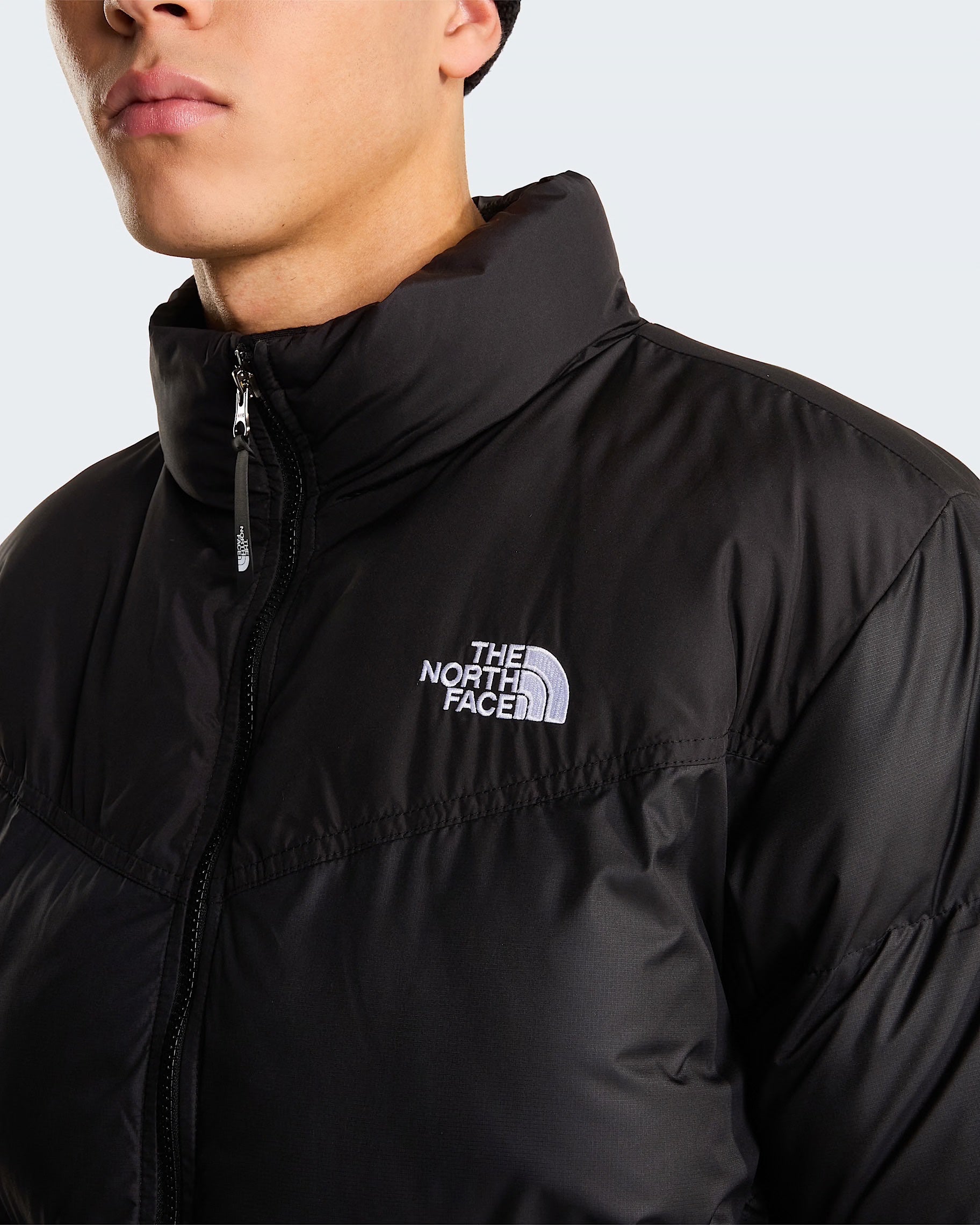 Giubbino nero da uomo Saikuru WindWall di Follower SRL con logo The North Face ricamato sul petto e collo alto