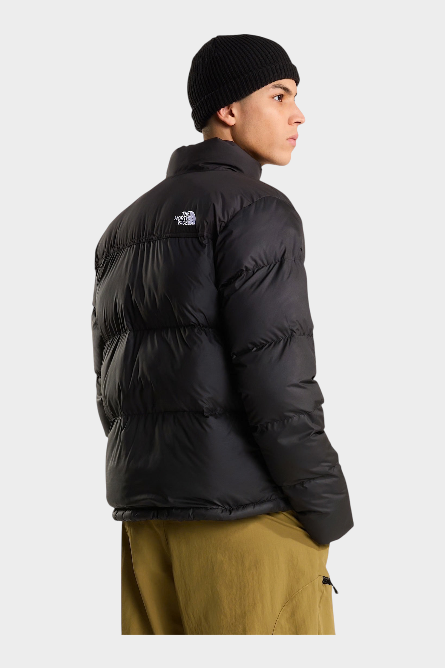 Modello indossa giubbino nero The North Face Saikuru con tecnologia WindWall, vista posteriore, Follower SRL