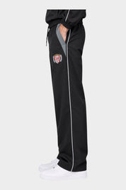 Pantaloni jogger Follower SRL GUESS in nylon nero con profili bianchi, inserti grigi e stemma laterale