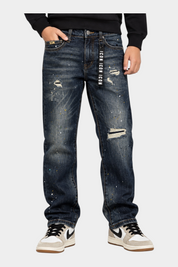 Jeans larghi regular fit Follower SRL per bambino in denim blu con strappi, dettagli effetto vernice e logo ICON