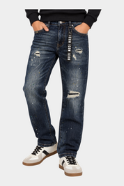 Jeans larghi regular fit Follower SRL blu in denim con strappi, macchie di vernice e nastro logo ICON in vita