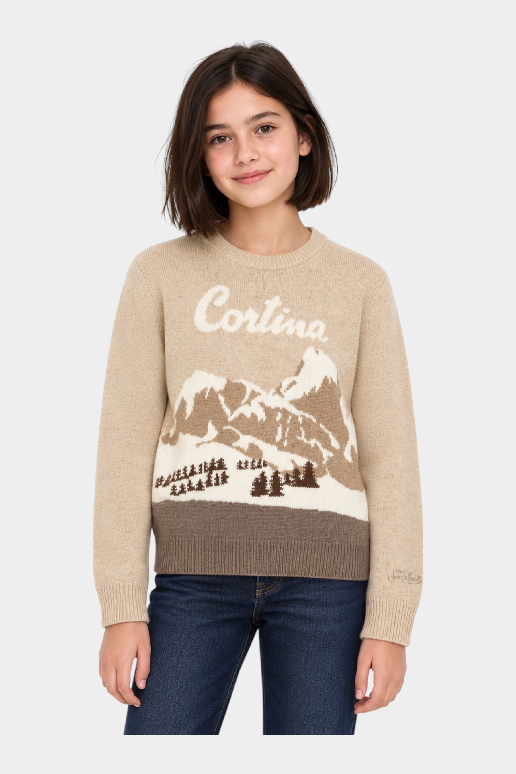 Bambina indossa maglia girocollo Follower SRL beige con intarsio paesaggio montano Cortina e dettagli a costine