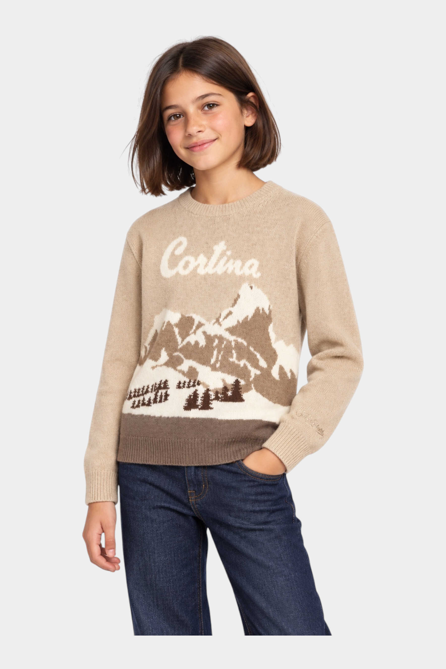 Bambina indossa maglia girocollo Follower SRL beige con intarsio paesaggio montano Cortina e dettagli a costine