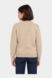 Vista posteriore di una bambina che indossa un maglione girocollo Follower SRL beige melange a maniche lunghe