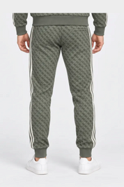 Follower SRL pantalone jogger uomo verde con stampa logo iconico GUESS e bande laterali bianche, vista posteriore