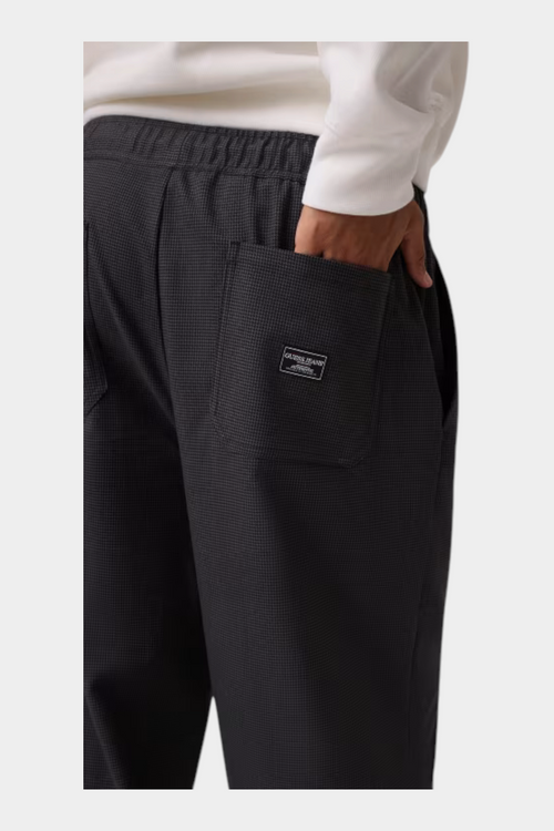 Pantalone a gamba larga Follower SRL GUESS grigio con motivo micro-check e tasca posteriore con etichetta logo